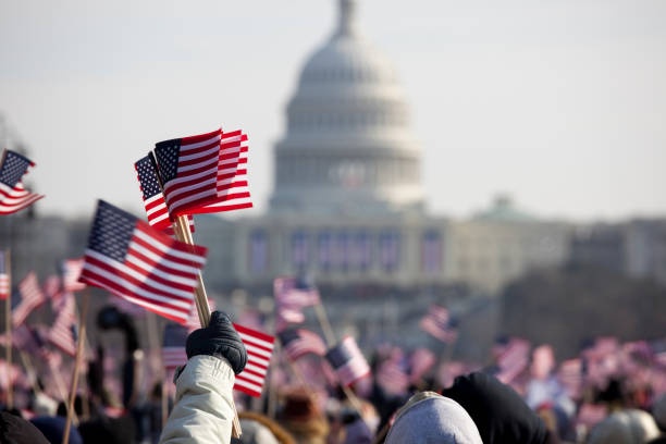 crowd,protest,signs,flags,rally