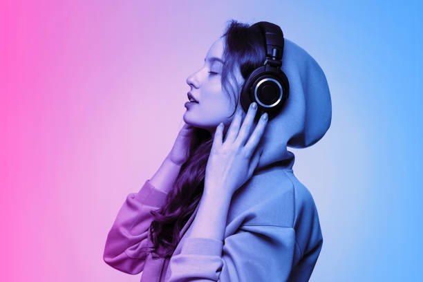 woman listening to music, headphones, studio, cozy