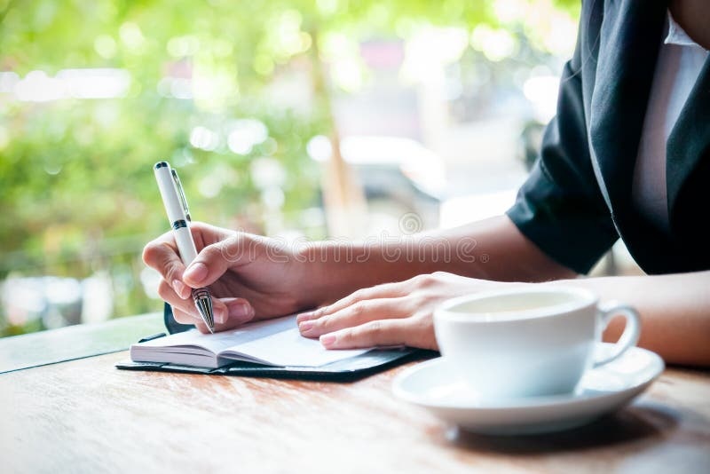 woman writing affirmations, journal, pen, positivity