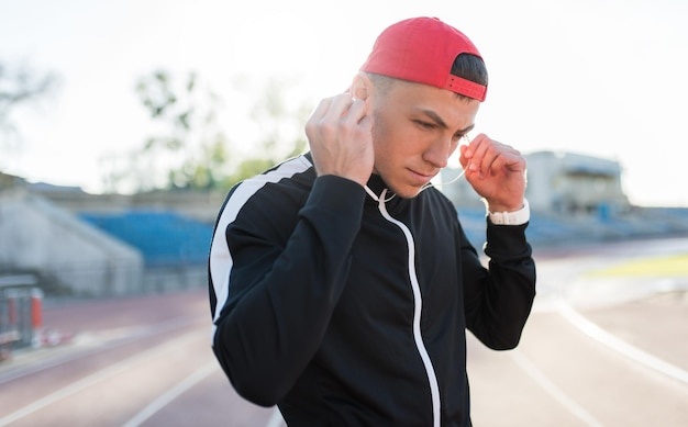 man listening music while running