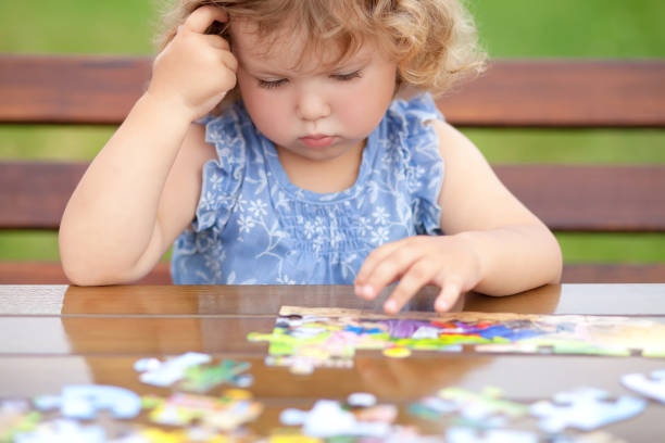 child, boy, trying, puzzle, perseverance, realistic