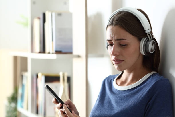 sad woman, headphones, stress, frustration