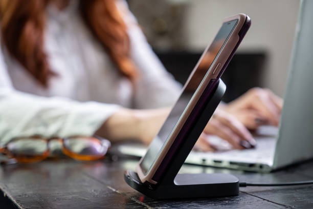 modern smartphone, wireless charger, desk, home office