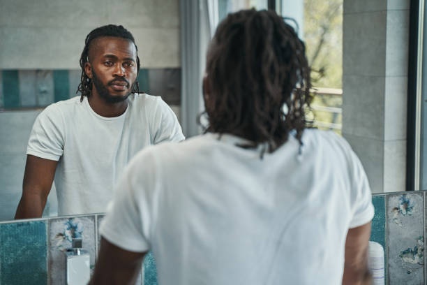 man looking at reflection, stress, career