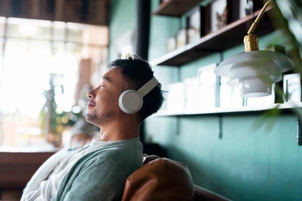 person,listening,headphones,calm
