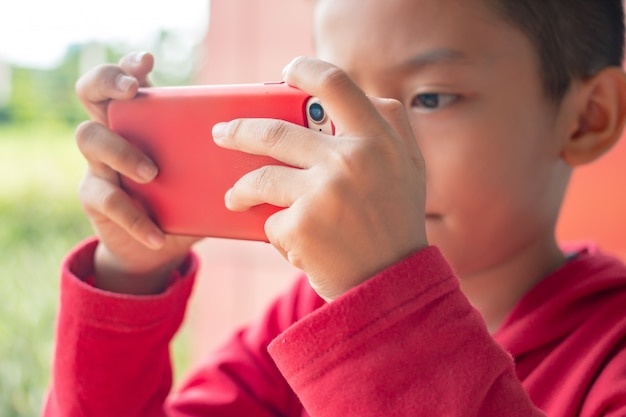 child playing with smartphone