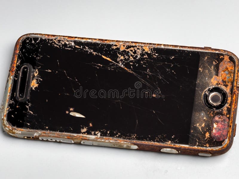 old smartphone, cracked screen, dust